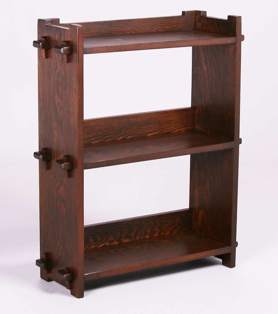 California A&C Douglas Fir Bookshelf 1910-1915: California Arts & Crafts douglas fir bookshelf with tenon & key construction c1910-1915. Unsigned. Refinished. 28″h x 23″w x 8″d. Larger pieces are shipped via Steve Auger Shipping. 
