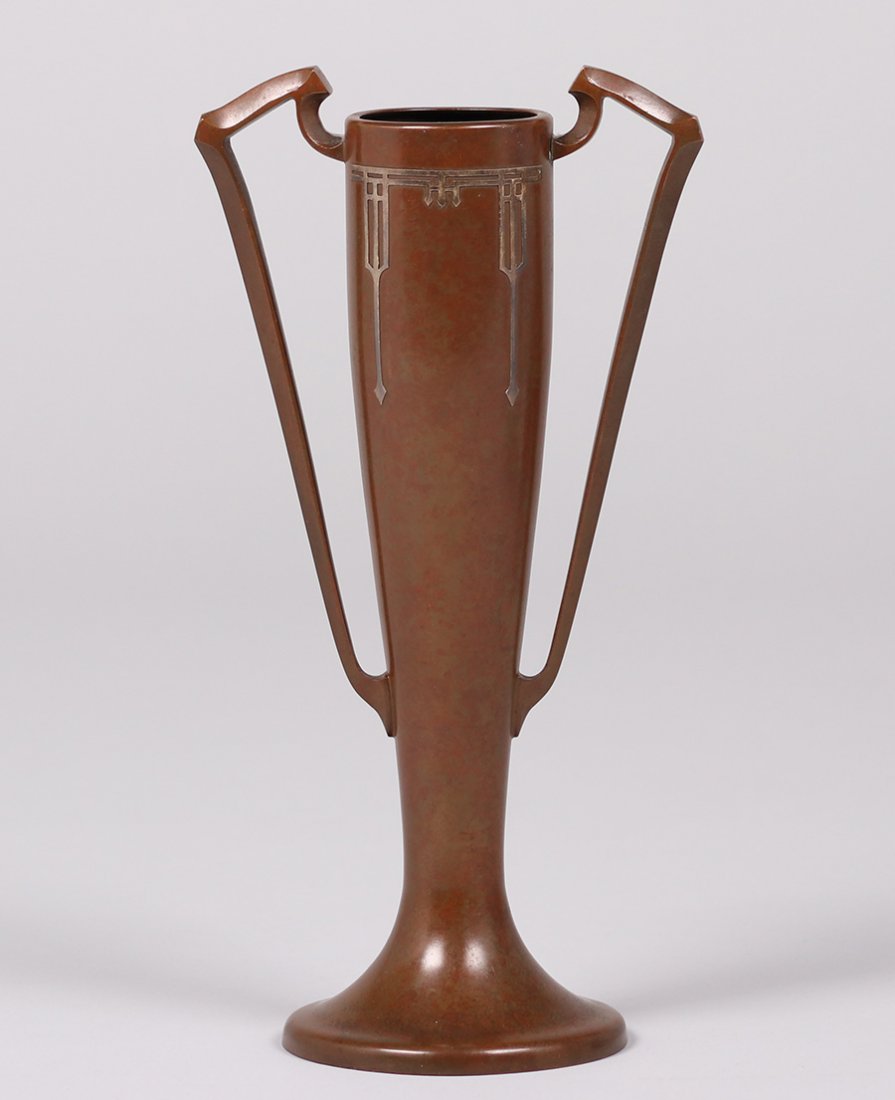 Silvercrest Sterling on Bronze Vase: Silvercrest sterling on bronze two-handle vase. Signed. Excellent original patina. 11"h x 5.75"w. We box and ship ourselves, to keep shipping costs low. We do not use a packaging service, unless the c
