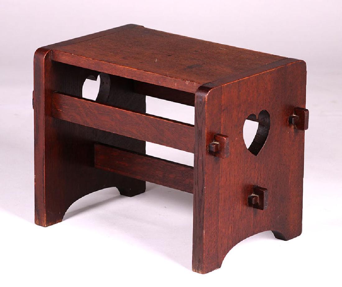 Paine Furniture Co Footstool c1910: Paine Furniture Co footstool with heart cutout and tenon & key construction c1910. Signed. Original finish. 19"w x 12"d x 14.25"h. Spend $5000 or more at this auction and all of your SHIPPING IS FREE 