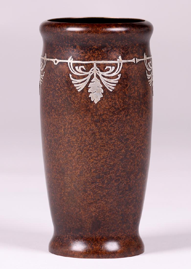 Silvercrest Sterling on Bronze Pine Come Overlay Vase: Silvercrest sterling on bronze pine cone overlay vase. Signed. Excellent new patina. 8.25"h x 4"d. Spend $5000 or more at this auction and all of your SHIPPING IS FREE within the lower 48 states.SHIPP