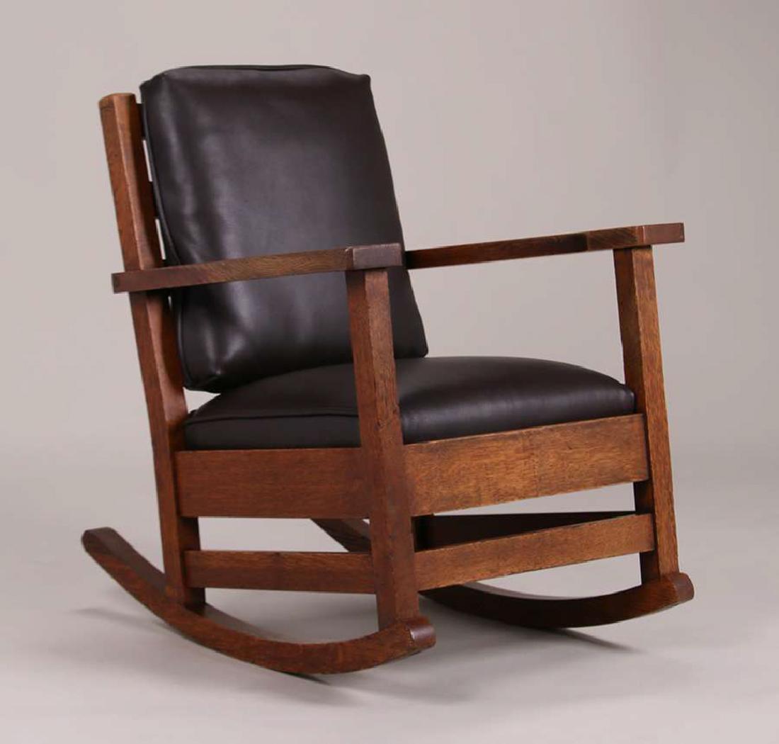 Limbert Rocker c1902-1905: Early Limbert rocker c1902-1905. Excellent original finish. Signed twice with early paper label under arm and under seat. 33"h x 27.25"w x 32.5"d. Spend $5000 or more at this auction and all of your