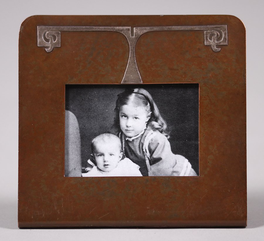 Silvercrest Sterling on Bronze Calendar Frame: Silvercrest sterling on bronze desk calendar - perfect for a picture frame. Signed. Excellent original patina. 3 7/8"w x 3.75"h. Picture area 1.75"h x 2.25"w. Spend $5000 or more at this auction and a