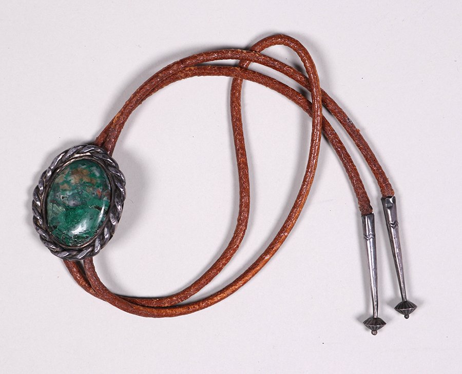 Navajo Sterling & Leather Bolo Tie Old Green Turquoise: Navajo sterling silver and leather bolo tie with old green turquoise. 35" long. Center piece 2" x 1.75". Spend $5000 or more at this auction and all of your SHIPPING IS FREE within the lower 48 states