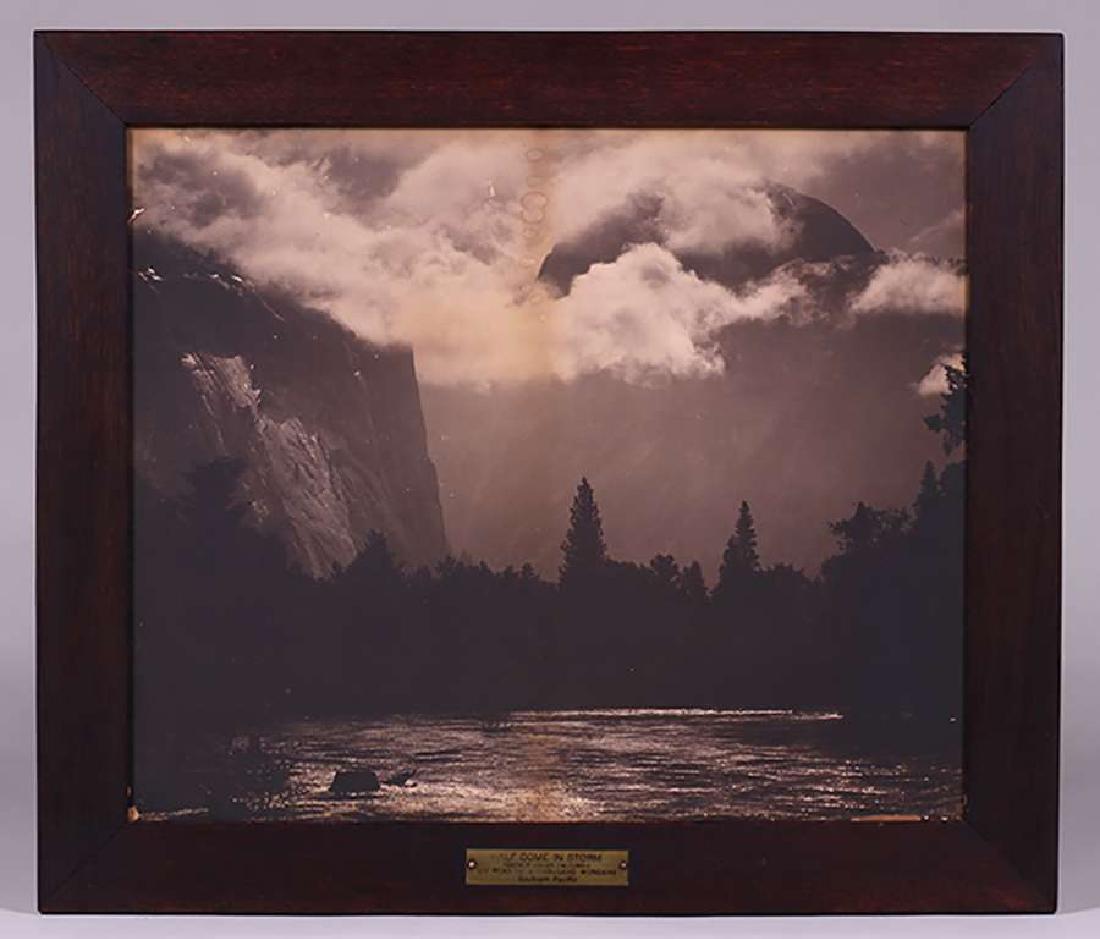 Antique Southern Pacific Photo "Half Dome in Storm": Antique Southern Pacific Yosemite photo entitled "Half Dome in Storm" c1900. Discoloration to photo. 20"h x 24"w. Original frame 25"h x 28.75"w Spend $5000 or more at this auction and all of your SHIP