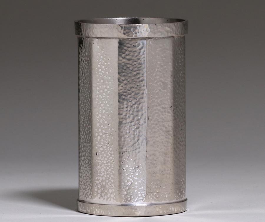 Joseph Heinrichs Hammered Pewter Wine Cooler c1910: Joseph Heinrichs hammered pewter wine cooler c1910. Signed. Excellent condition. 7"h x 4"d. Spend $5000 or more at this auction and all of your SHIPPING IS FREE within the lower 48 states. SHIPPING<