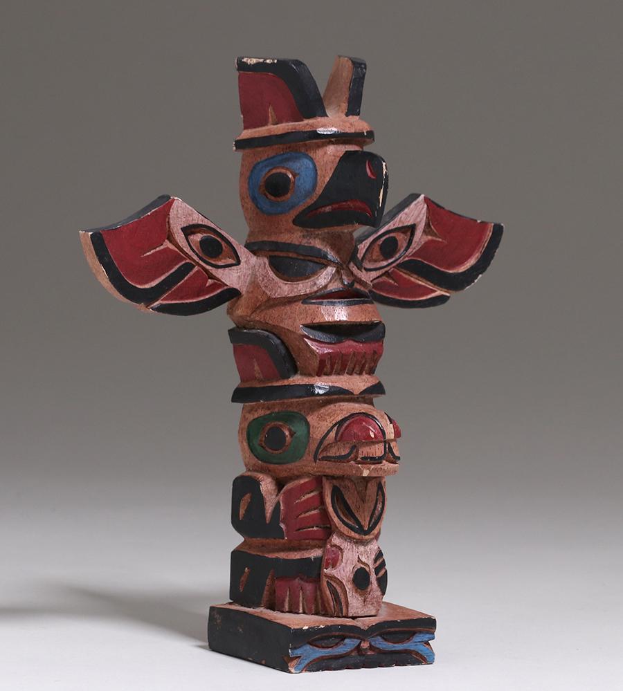 Northwest Coast Carved Totem Pole c1950s: Northwest Carved Totem Pole c1950s. Several edge flakes to paint, otherwise excellent condition. 10.5"h x 8.75"w. Spend $5000 or more at this auction and all of your SHIPPING IS FREE within the lower 