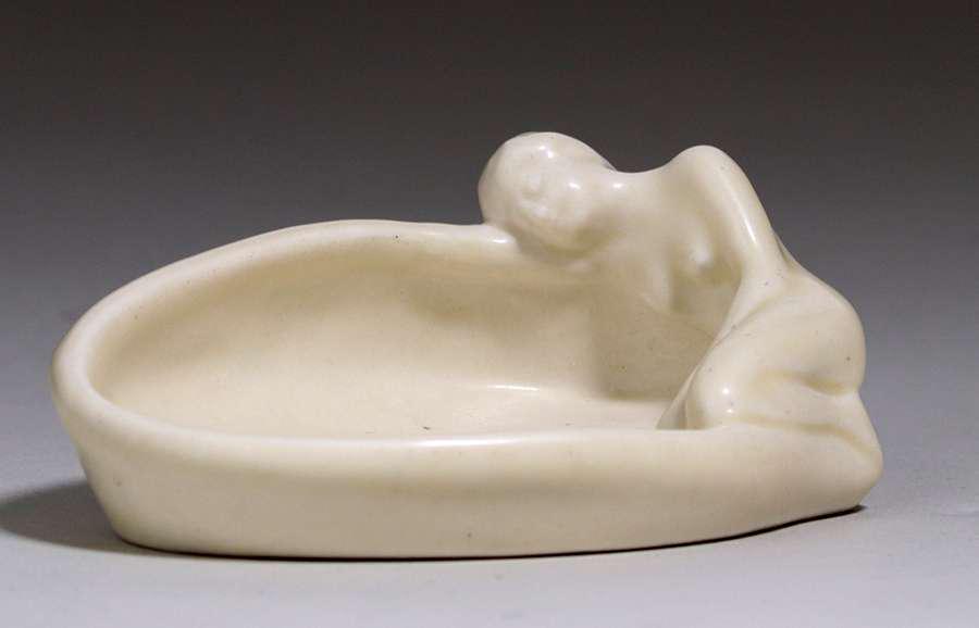 Rookwood Tray Female Nude 1929: Rookwood Anna Valentien designed matte white tray encircled by female nude. Dated 1929. Perfect condition. 4.25"w x 3" x 1.75"h. Spend $5000 or more at this auction and all of your SHIPPING IS FREE wi