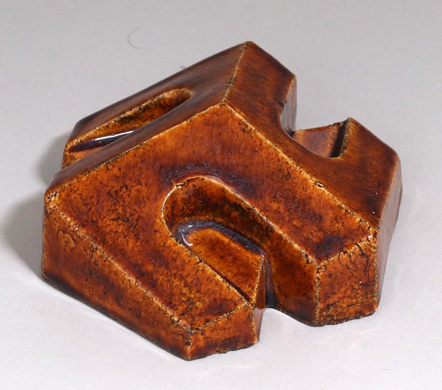 Delft Geometric Tile c1920s: Dutch Porceleyne Fles geometric architectural tile with a high-gloss brown glaze. Impressed "Delft". Perfect condition. 4.5"d. Spend $5000 or more at this auction and all of your SHIPPING IS FREE with