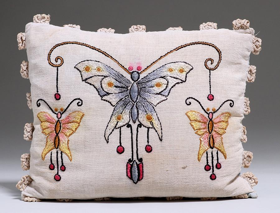 Arts & Crafts Butterfly Embroidered Pillow c1910: Arts & Crafts butterfly embroidered pillow c1910. Minor stains on front. Staining to back. 18"w x 15"h. Spend $5000 or more at this auction and all of your SHIPPING IS FREE within the lower 48 states.