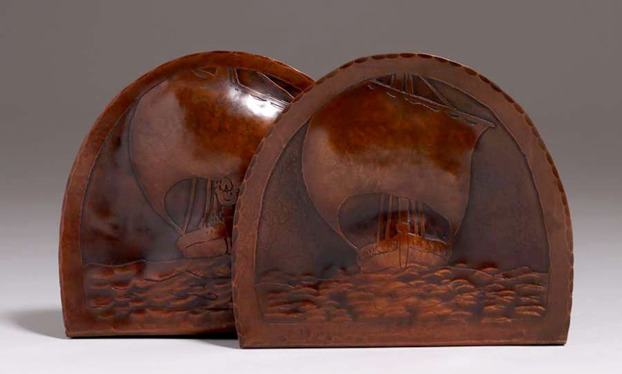 Harry Dixon Hammered Copper Acid-Etched Ship Bookends: Harry St John Dixon hammered copper acid-etched galleon ship bookends c1925. Excellent new patina. Signed. 6″h x 6.75″w x 6.25″d. Spend $5000 or more at this auction and all of your
