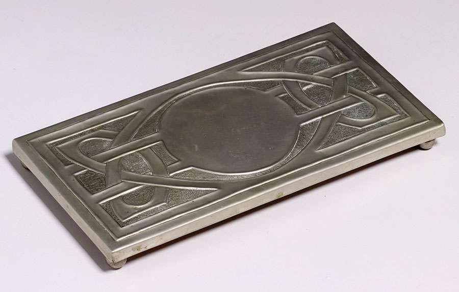 Glasgow Pewter Trivet c1910: Glasgow Pewter Trivet c1910. Unsigned. Excellent condition. 15.75" x 7.25". Spend $5000 or more at this auction and all of your SHIPPING IS FREE within the lower 48 states. SHIPPING We box and ship ou