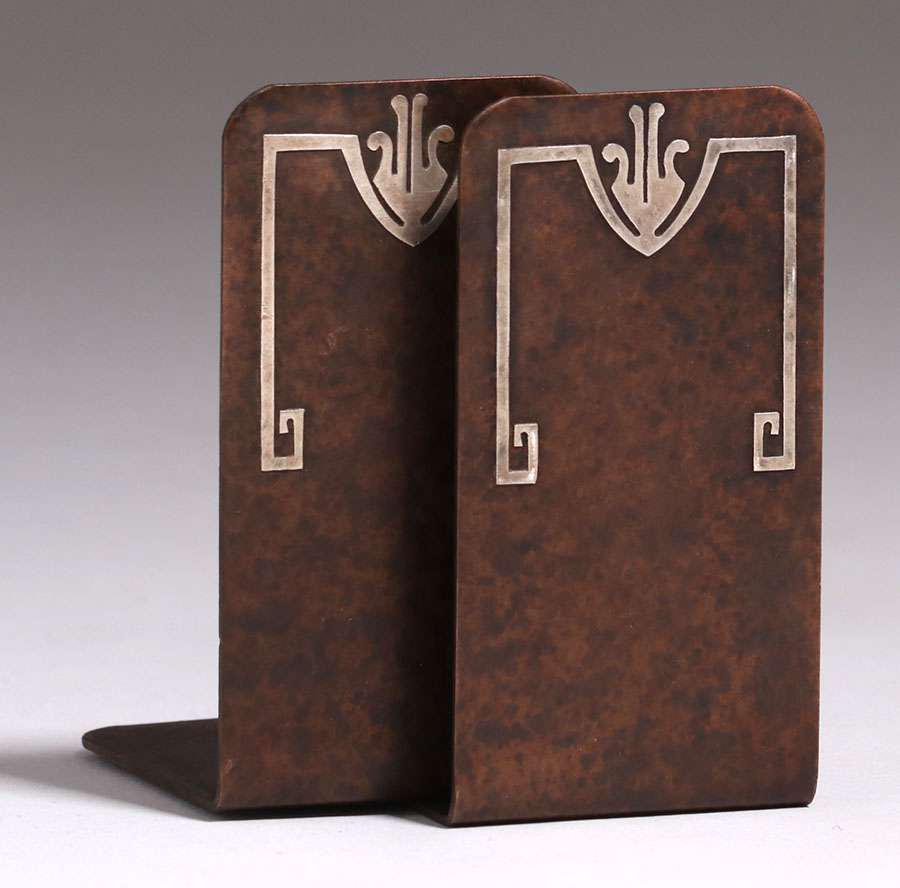 Silvercrest Sterling on Bronze Overlay Bookends c1920: Silvercrest Sterling on Bronze Overlay Bookends c1920. Signed. Excellent new patina. 3.75"h x 2"w. Spend $5000 or more at this auction and all of your SHIPPING IS FREE within the lower 48 states. SHIP
