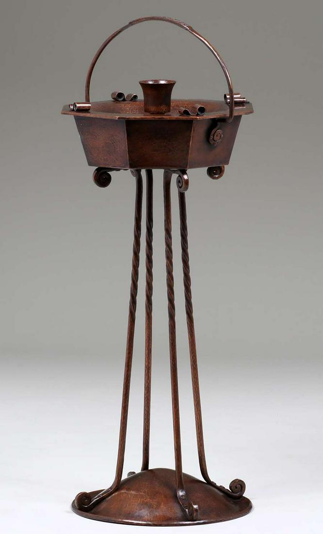 Harry Dixon Hammered Copper Cigar Standing Ashtray: Harry St John Dixon Hammered Copper Cigar Standing Ashtray c1925-1930. Enamel design on handle. Signed. Excellent new patina. 38"h x 14.5"d. Spend $5000 or more at this auction and all of your SHIPPIN