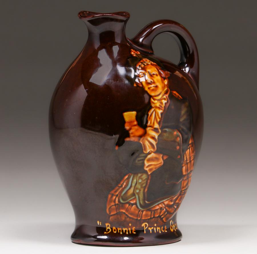 Royal Doulton Bonnie Prince Charlie Kingsware Dewars: Royal Doulton Bonnie Prince Charlie Kingsware Dewars Whiskey Flask c1900. Signed. Perfect condition. 7"h x 4.75"w x 3.75". Spend $5000 or more at this auction and all of your SHIPPING IS FREE within t