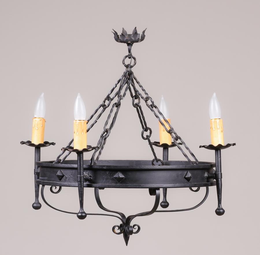 Spanish Iron Hand-Forged Chandelier c1920s: Spanish Iron Hand-Forged Chandelier c1920s. Unsigned. Nicely painted black. Maximum diameter 25.5". Center circular piece 20"d. 24"h overall. Ceiling cap 4"d. SHIPPING We box and ship ourselves, to ke