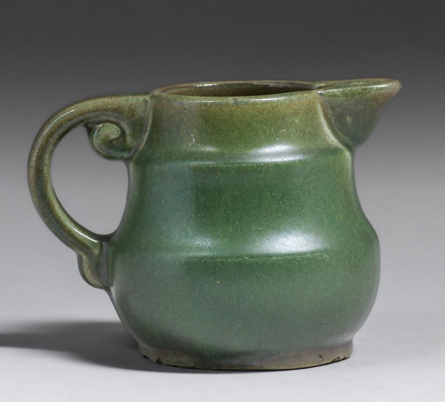 Fulper Pottery Matte Green Creamer c1920: Fulper Pottery Matte Green Creamer c1920. Signed. Excess grinding to base, otherwise perfect condition. 4h x 5.5w inches. Spend $5000 or more at this auction and all of your SHIPPING IS FREE within th