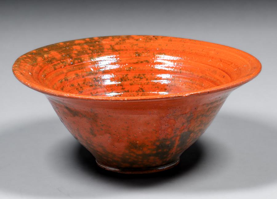 Auman Pottery - Seagrove, NC Orange Bowl: Auman Pottery - Seagrove, NC Orange Bowl. Unsigned. Glazed over chip on rim. Perfect condition. 11 5/8"d x 5"h. Spend $5000 or more at this auction and all of your SHIPPING IS FREE within the lower 48
