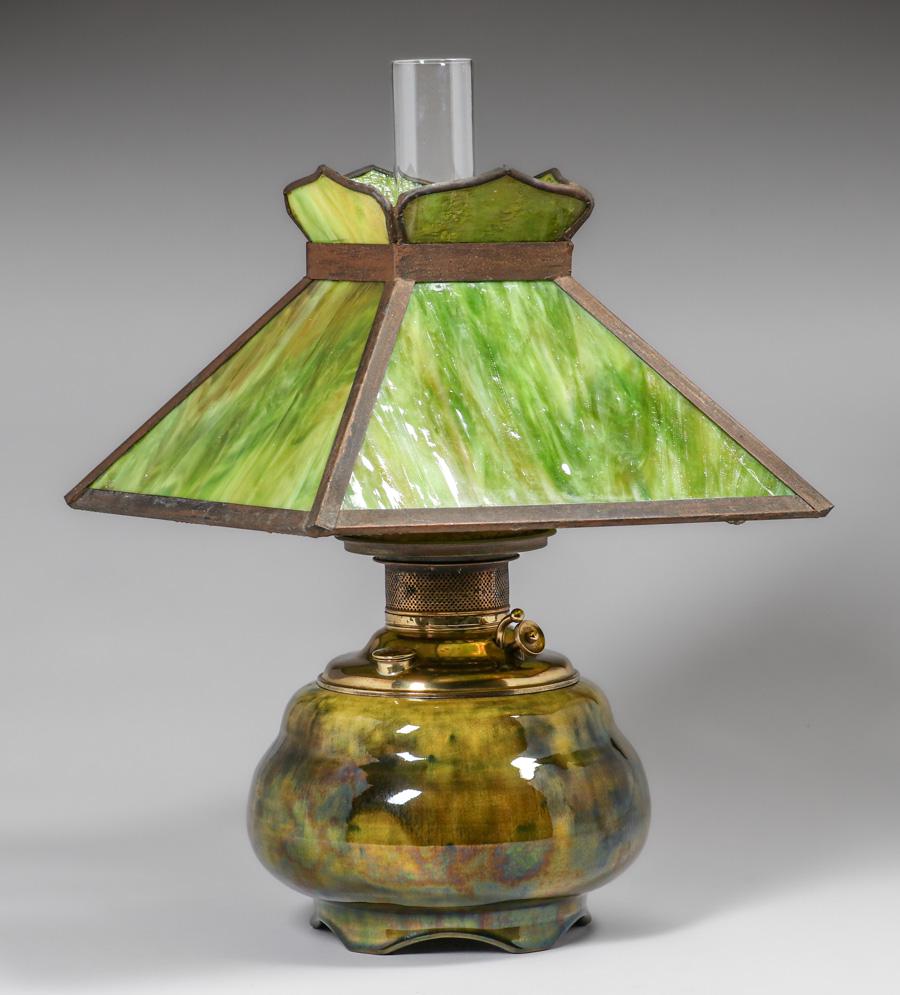 Volkmar Pottery Keorsene Lamp c1900s: Volkmar Pottery Keorsene Lamp c1900s. Signed. Bruise to internal rim and glazed over firing line in base. Original slag glass shade two lines.18"h to top of glass chimney x 12" x 12". Spend $5000 or m