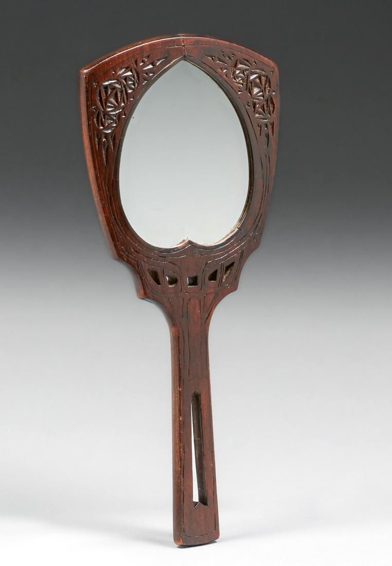 Glasgow Arts & Crafts Spoon-Carved & Cutout Hand Mirror c1900s: Glasgow Arts & Crafts Spoon-Carved & Cutout Hand Mirror c1900s. Unsigned. Original finish. 13" x 5.75"w. Spend $5000 or more at this auction and all of your SHIPPING IS FREE within the lower 48 states