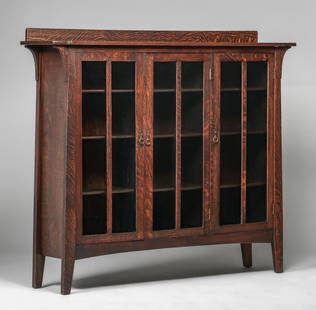 Limbert Three-Door Bookcase c1905: Limbert Three-Door Bookcase c1905. One of the nicest examples of quarter-sawn oak on this form that we have ever seen. Signed with early paper label. Very nicely refinished. 67.5"w x 57.25"h x 14.5"d.