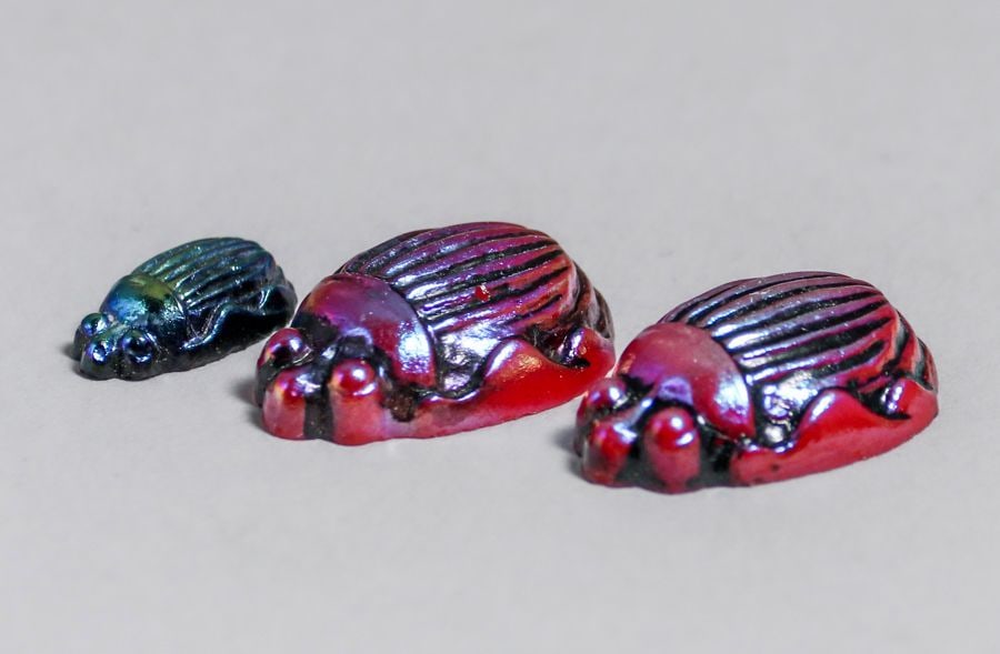 Tiffany Studios Miniature Favrile Glass Scarabs c1910: Tiffany Studios Miniature Favrile Glass Scarabs c1910. Unsigned. Perfect condition. Largest 0.75" x 0.25". Spend $7500 or more at our two day auction and all of your SHIPPING IS FREE within the lower 