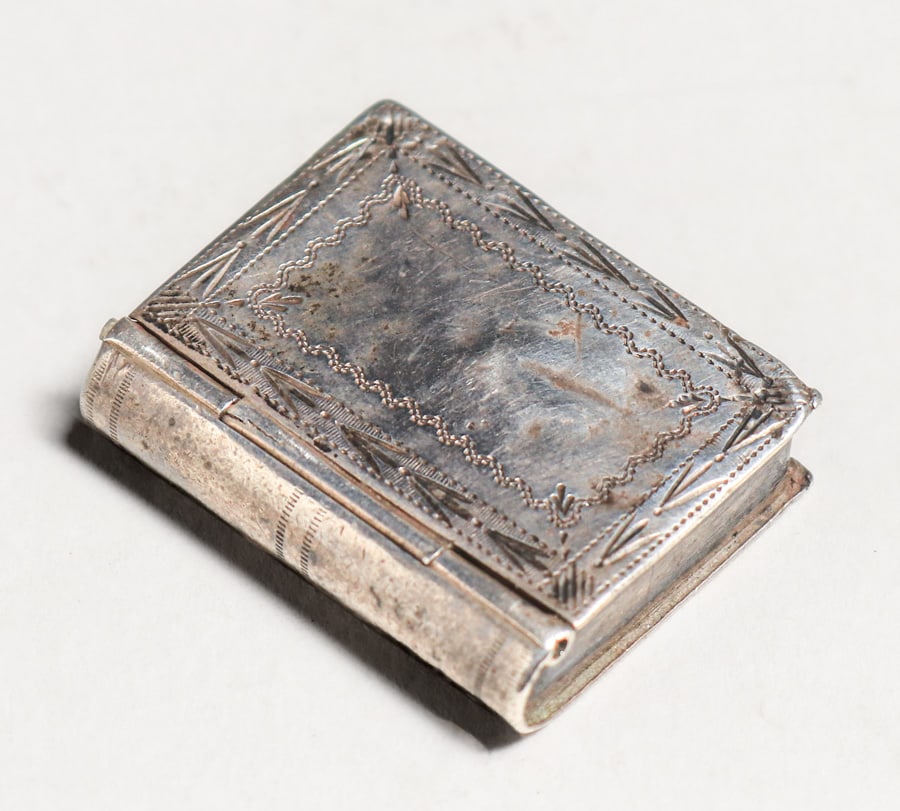 English Hallmarked Sterling Silver Book-Shaped Pill Box c1890s: English Hallmarked Sterling Silver Book-Shaped Pill Box c1890s. Signed. 1 1/8"h x 7/8"w x 0.25". Spend $7500 or more at our two day auction and all of your SHIPPING IS FREE within the lower 48 states.