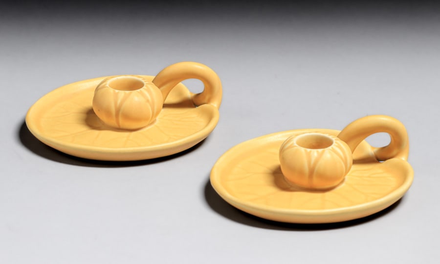 Rookwood Pottery #1067 Matte Yellow Lily Pad Candlesticks 1921: Rookwood Pottery #1067 Matte Yellow Lily Pad Candlesticks 1921. Signed. Perfect condition. 5.5"w x 1 5/8"h. Spend $7500 or more at our two day auction and all of your SHIPPING IS FREE within the lower