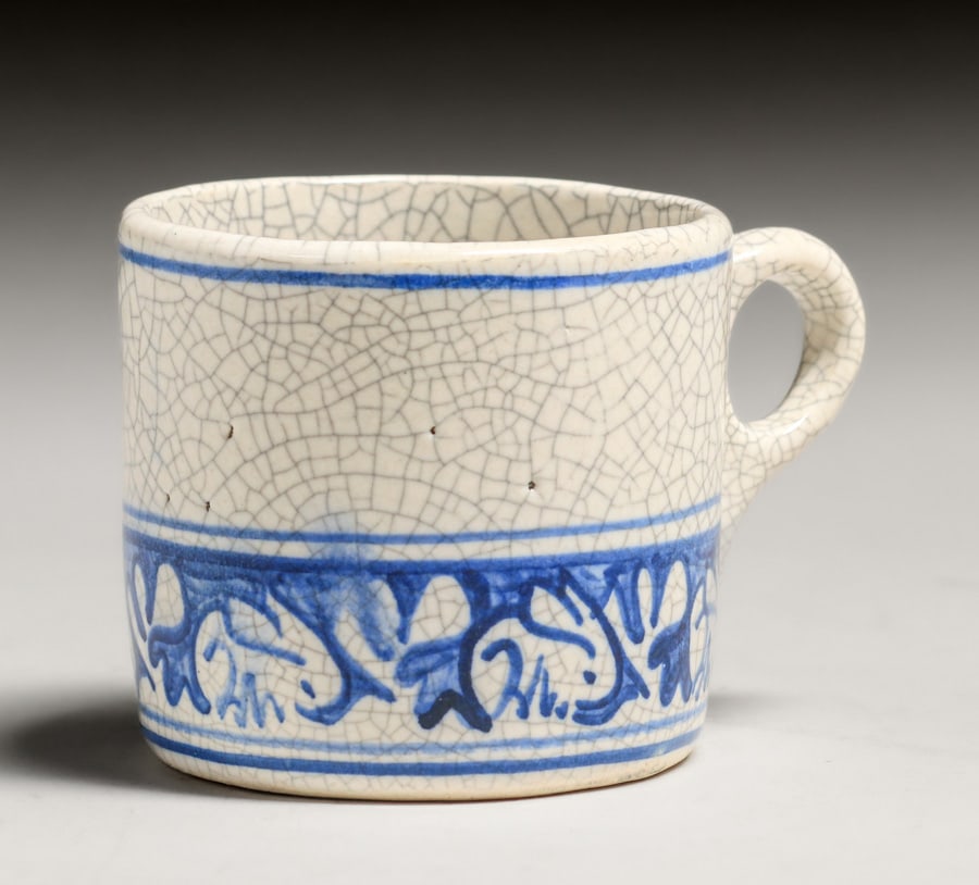 Dedham Pottery Rabbit Tea Cup c1920s: Dedham Pottery Rabbit Tea Cup c1920s. Signed. Some glaze bubbles, otherwise perfect condition. 4"w x 2.75"h x 3"d. Spend $7500 or more at our two day auction and all of your SHIPPING IS FREE within th