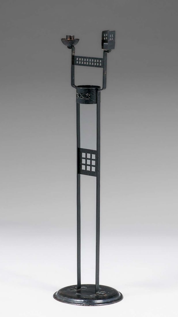 German Secessionist Cutout Iron Standing Candlestick c1900s: German Secessionist Cutout Iron Standing Candlestick c1900s. Similar to Joseph Hoffman. Unsigned. Excellent original patina. 35"h x 9.25"d. FREE NATIONWIDE SHIPPING for all of your purchases at our Tw