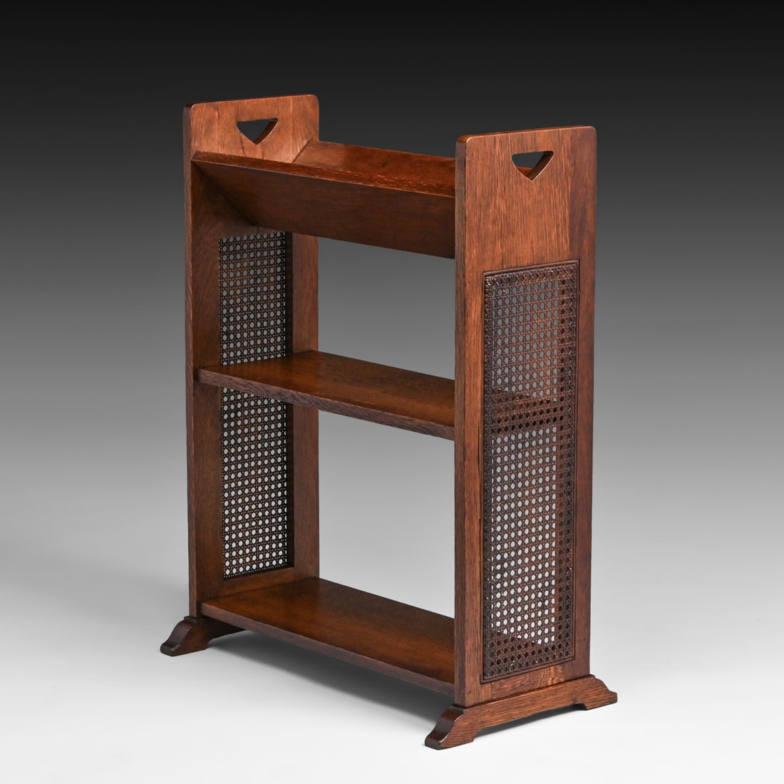 Stickley Brothers Prairie School Oak & Cane Book Trough c1910: Stickley Brothers Prairie School Oak & Cane Book Trough c1910. Signed only with a retailer's label. Excellent original finish and original cane. 32"h x 24.5"w x 13.25"d FREE NATIONWIDE SHIPPINGFree