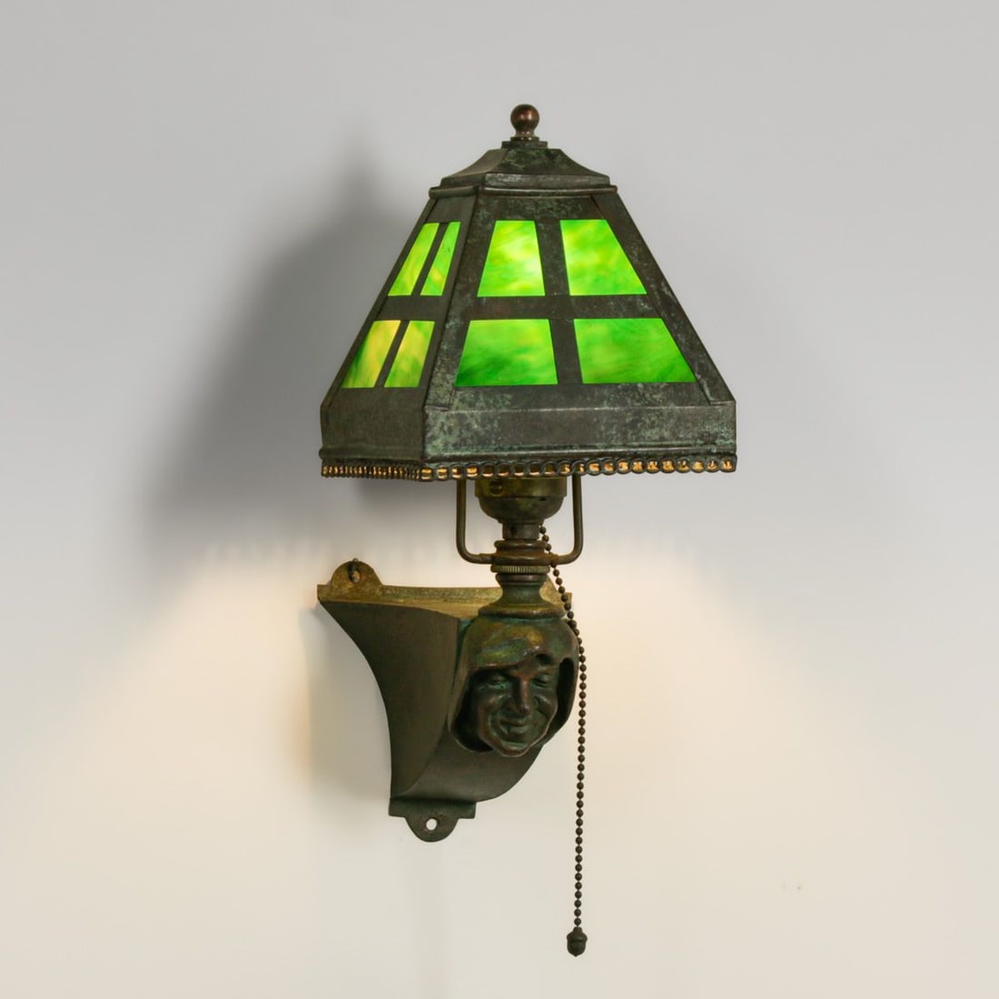 John L. Gaumer Co - Philadelphia Monk's Head Green Slag Glass Sconce c1910: John L. Gaumer Co - Philadelphia Monk's Head Green Slag Glass Sconce c1910. Unsigned. Color added to original patina. Original green slag glass in perfect condition. 13"h overall. 5.25"w x 6 5/8" dept