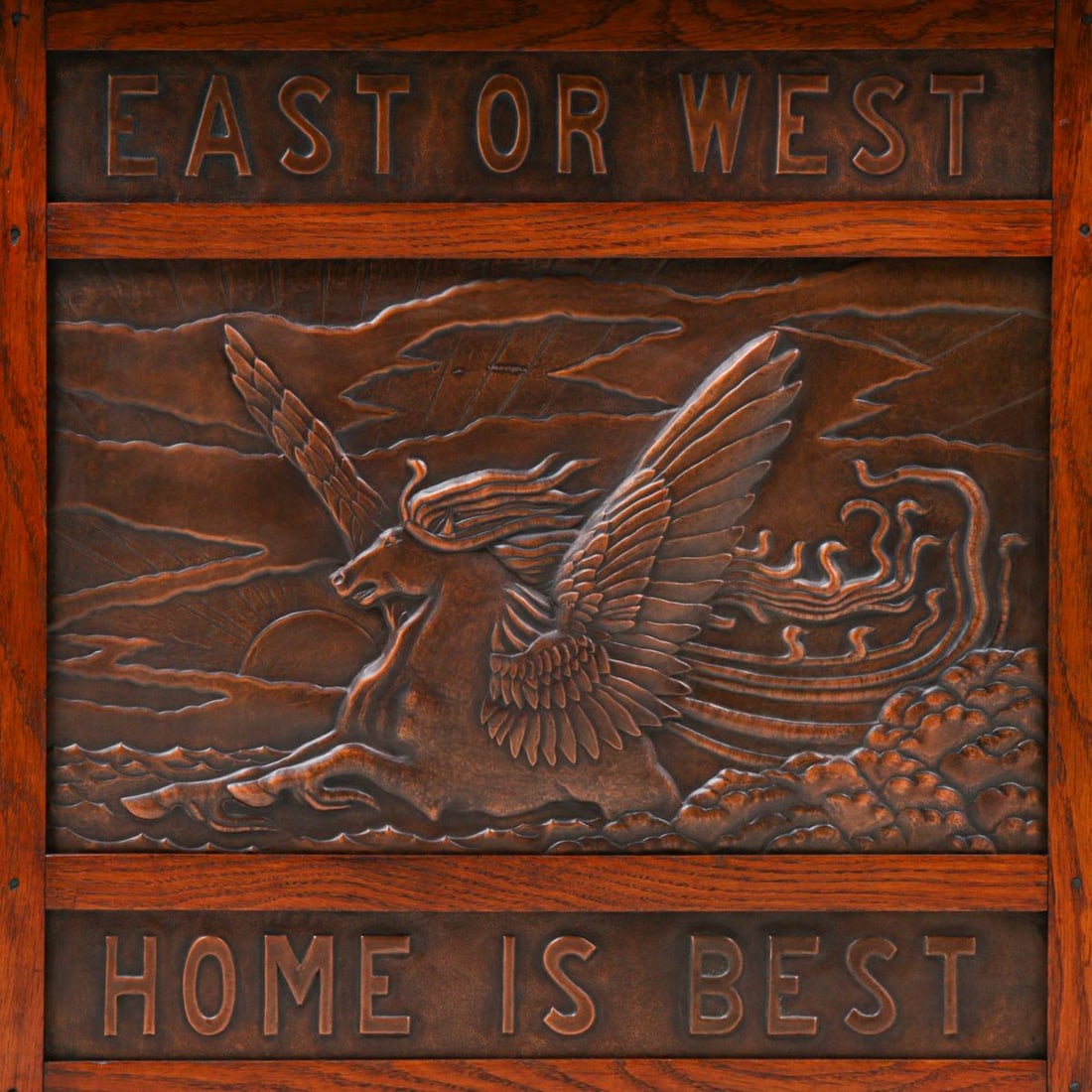 D.W. Cameron Hammered Copper & Oak Fire Screen 1902: D.W. Cameron Hammered Copper & Oak Fire Screen 1902. "East or West Home is Best" with a winged Pegasus Horse motif. Unsigned. Excellent original finish. Excellent new patina to copper. 25.25"w x
