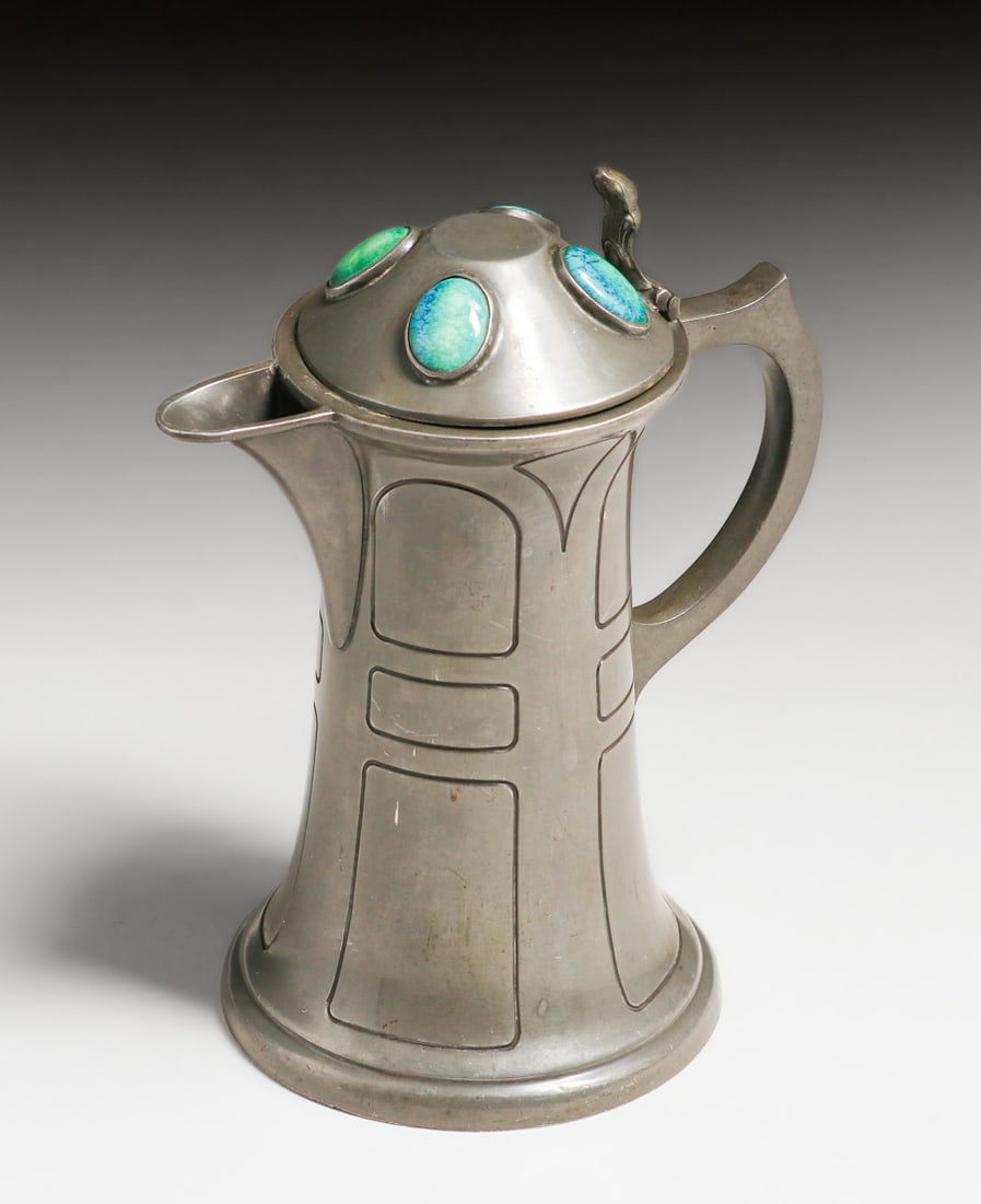 William Hutton & Sons - Sheffield, England Pewter & Ruskin Enamel Cabochon Pitcher c1900s: William Hutton & Sons - Sheffield, England Pewter & Ruskin Enamel Cabochon Pitcher c1900s. Signed. Excellent original patina. 8"h x 6"w x 4.5"d FREE NATIONWIDE SHIPPINGFree Nationwide Shipping