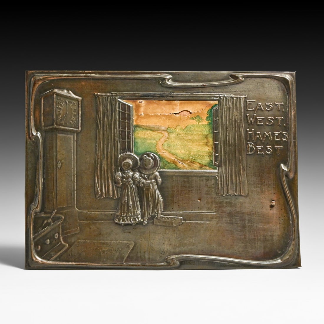 English Arts & Craft Hammered Copper Plaque – "East, West, Hames Best" c1900s: English Arts & Craft Hammered Copper Plaque – "East, West, Hames Best" c1900s. Signed with merchant’s label for "J. Dindsdale, Stationer and Printer, New Station St., LEEDS." Some tears to