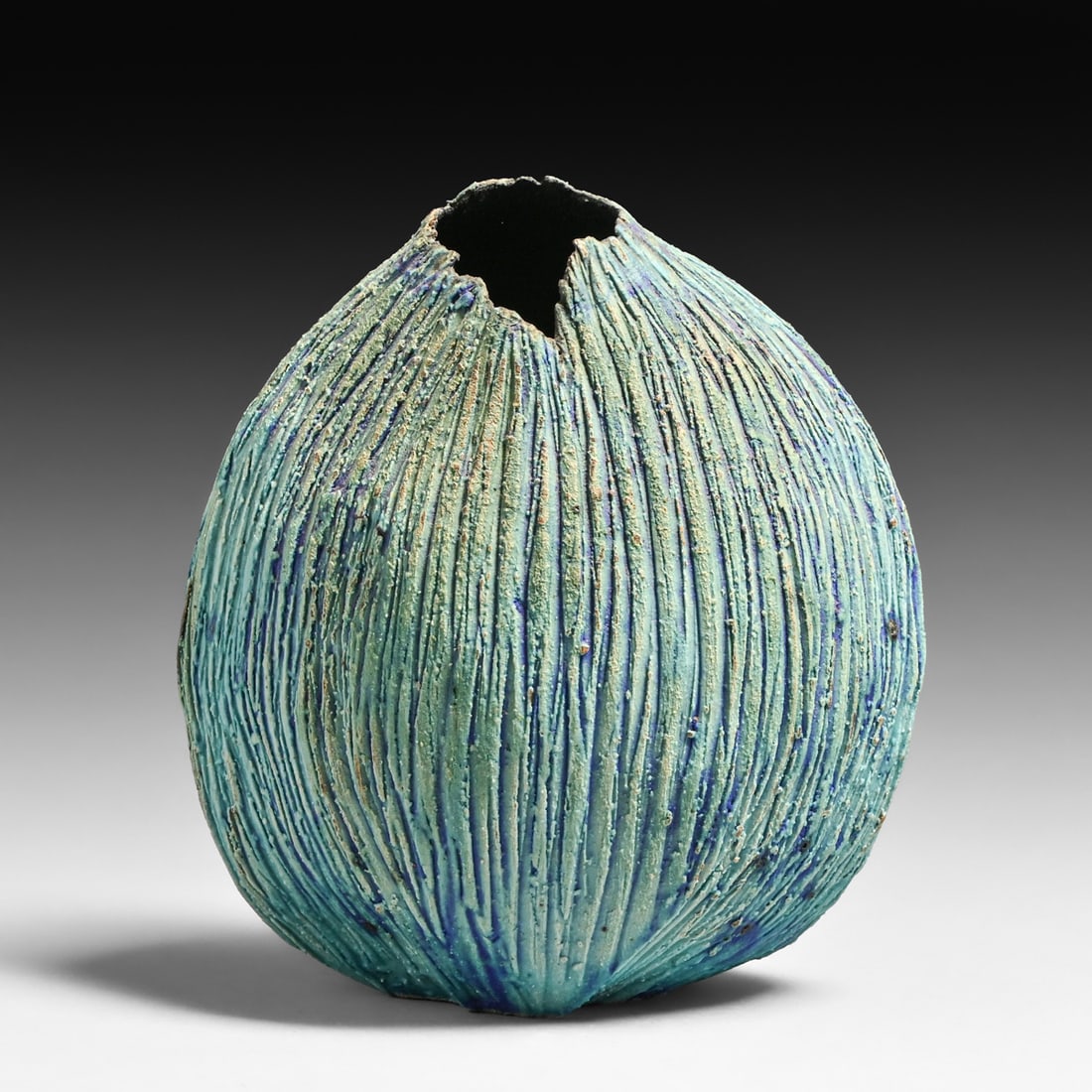 Museum-Quality Sara (Sally) King (1928–1995) Hand-Carved Studio Pottery Vessel: Museum-Quality Sara (Sally) King (1928–1995) Hand-Carved Studio Pottery Vessel. Signed. Perfect condition. 6.5"h x 6"w x 3.5" This exceptional stoneware vessel is a definitive work by Sara