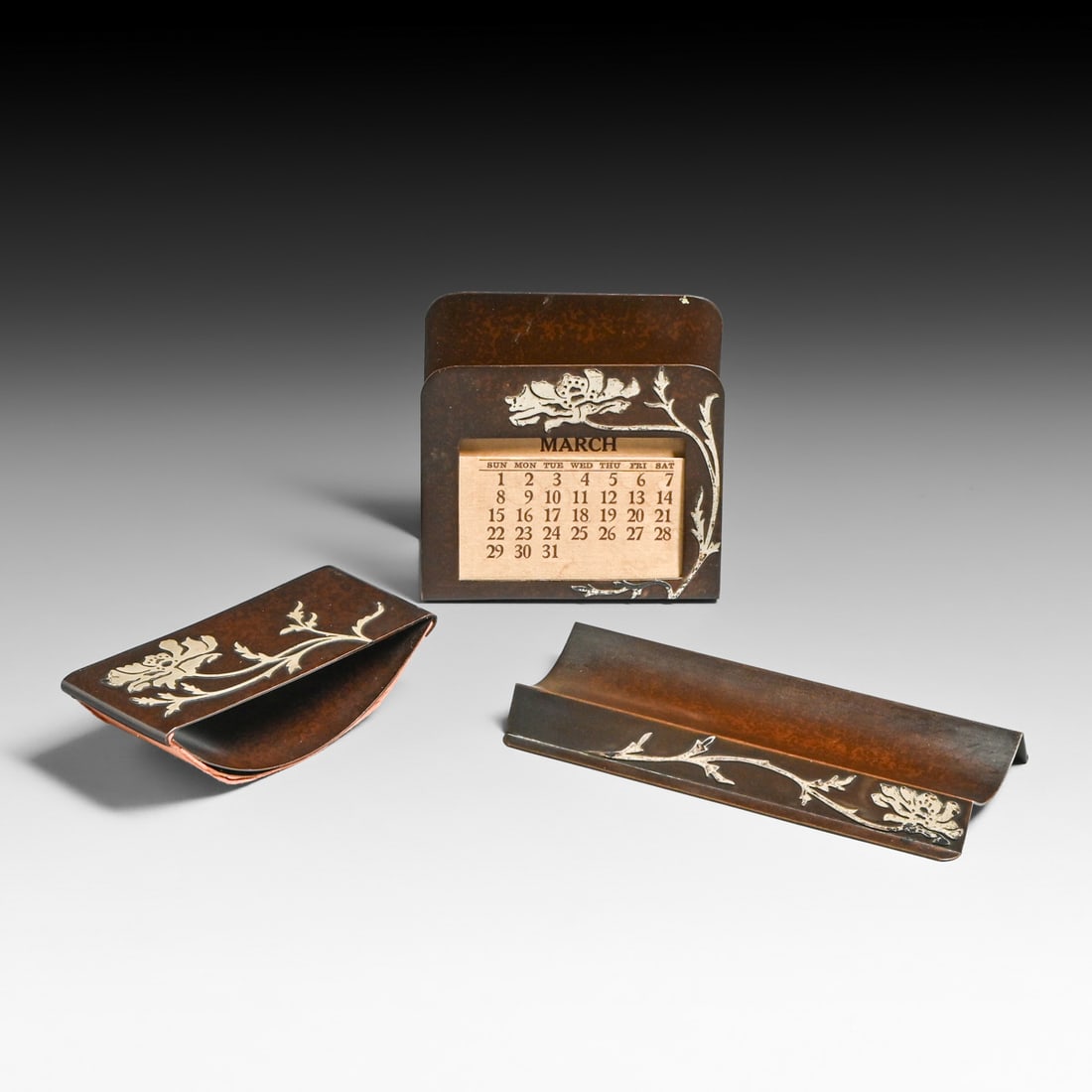 Heintz Sterling on Bronze #1175 Three Piece Desk Set c1915: Heintz Sterling on Bronze #1175 Three Piece Desk Set c1915. Signed. Excellent original patina. Rolling blotter 4.5"w x 1 7/8" x 1 1/8"h. Calendar 3 7/8"w x 3 5/8"h x 1.75"d. Pen tray 6"w x 2 5/8" x 5/