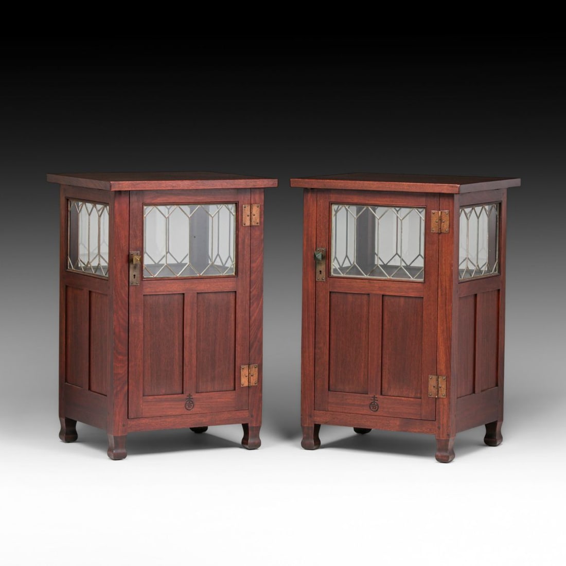 Pair Roycroft #055 Mahogany Leaded Glass Cabinets c1905: Pair Roycroft #055 Mahogany Leaded Glass Cabinets c1905. Extremely rare form that rarely surfaces. This is the only known pair. Signed. Excellent original finish. 40.25"h x 27"w x 22.5"d FREE