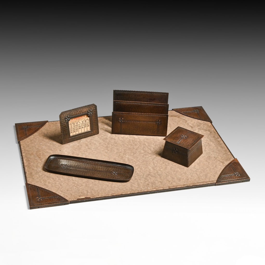Roycroft Hammered Copper Five Piece Desk Set c1920s: Roycroft Hammered Copper Five Piece Desk Set c1920s. Signed. Excellent original patina. Desk Blotter pad 21" x 14". Letter rack 4"h x 5.75"w x 2.25". Pen tray 8.5" x 2.75" Desk calendar 3.5"h x