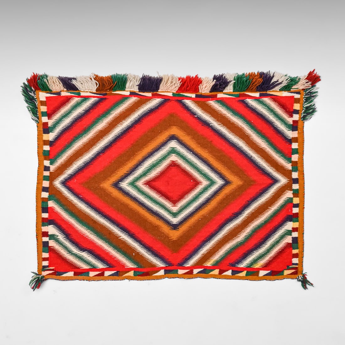 Navajo (Diné) "Eye Dazzler" Germantown Single Saddle Blanket c1880s: Navajo (Diné) "Eye Dazzler" Germantown Single Saddle Blanket c1880s. Some very slight color run, otherwise excellent condition. 34" x 26" FREE NATIONWIDE SHIPPING Free Nationwide Shipping within the 