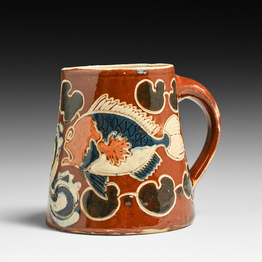C.H. Brannam Barum Ware - Barnstaple, England Sgraffito Stylized Fish Mug 1891: C.H. Brannam Barum Ware - Barnstaple, England Sgraffito Stylized Fish Mug 1891. Signed. Perfect condition. 3.75"h x 4"w FREE NATIONWIDE SHIPPING Free Nationwide Shipping within the lower 48 states