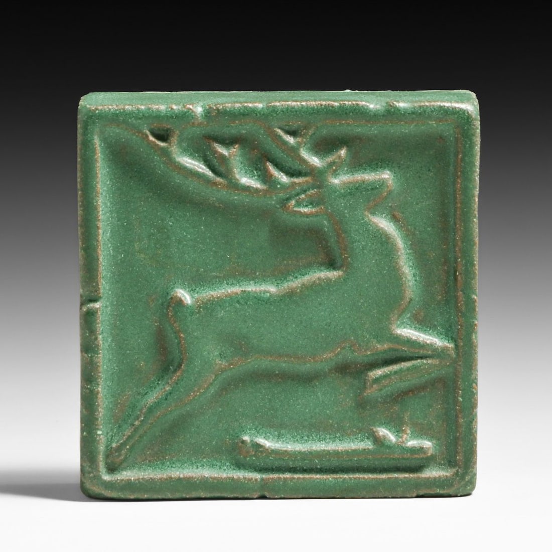 Grueby Pottery Matte Green Galloping Deer Tile c1910: Grueby Pottery Matte Green Galloping Deer Tile c1910. Signed. Perfect condition. 3.75" x 3.75" x 1.25" FREE NATIONWIDE SHIPPING Free Nationwide Shipping within the lower 48 states for all purchases