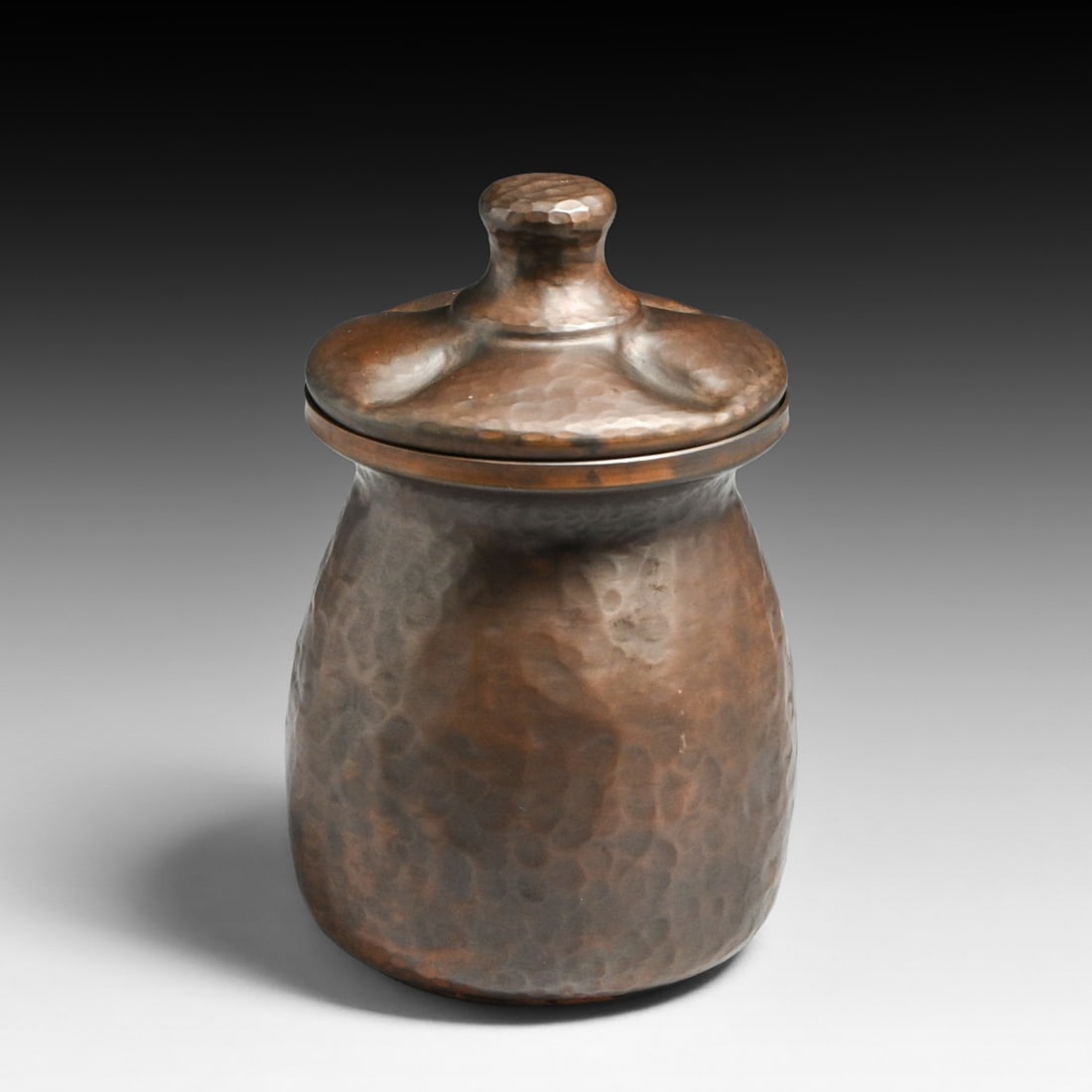 Arts & Crafts Period Hammered Copper Covered Vase c1920s: Arts & Crafts Period Hammered Copper Covered Vase c1920s. Unsigned. Worn original patina. 6.75"h x 4.25"d Buyer's Premium 27% A Buyer's Premium of 27% to be added to the hammer price of each lot if