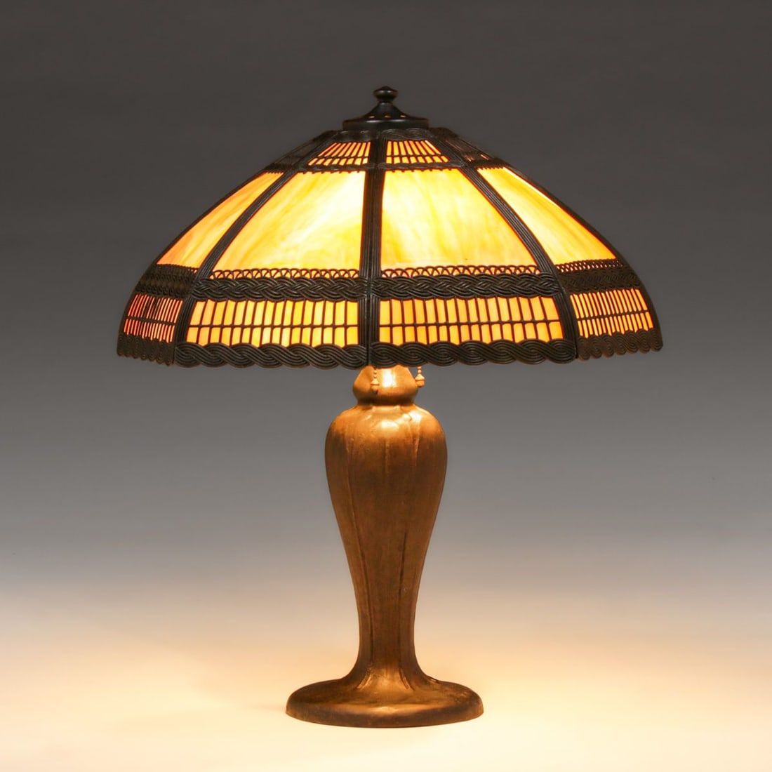 Handel Curved Glass Lamp c1910: Handel Curved Glass Lamp c1910. Base signed Handel. Shade probably by another maker of the same period. Excellent original patina. Original curved glass in perfect condition. 24"h x 21"d FREE