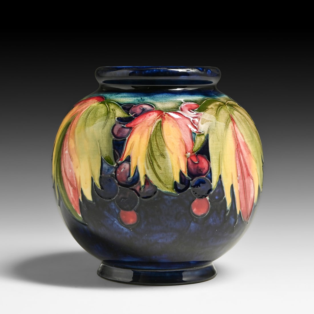 Moorcroft Pottery Leaf & Berry Vase c1928-1936: Moorcroft Pottery Leaf & Berry Vase c1928-1936. Signed. Perfect condition. 6"h x 6"d FREE NATIONWIDE SHIPPING Free Nationwide Shipping within the lower 48 states for all purchases at our Two-Day Aucti