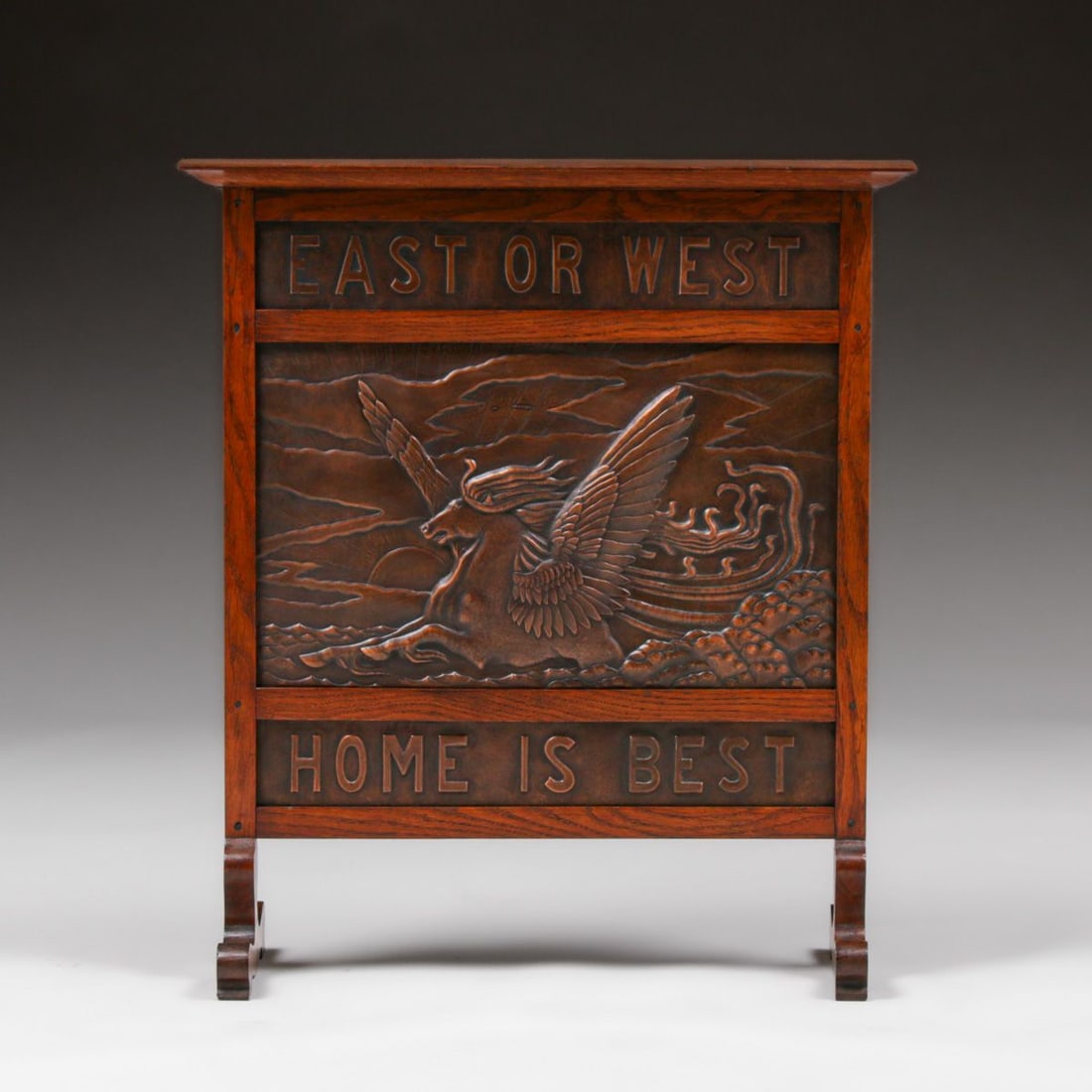 D.W. Cameron Hammered Copper & Oak Fire Screen 1902: D.W. Cameron Hammered Copper & Oak Fire Screen 1902. "East or West Home is Best" with a winged Pegasus Horse motif. Unsigned. Excellent original finish. Excellent new patina to copper. 25.25"w x
