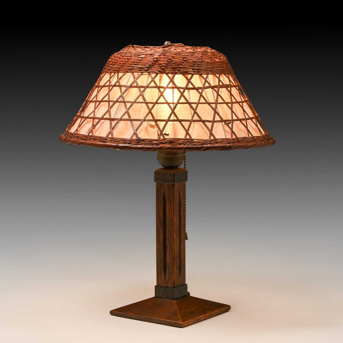 Gustav Stickley Oak & Japanese Wicker Shade Table Lamp c1910: Gustav Stickley Oak & Japanese Wicker Shade Table Lamp c1910. Unsigned. Excellent original finish. Some tears to silk liner. 15.5"h x 12"d FREE NATIONWIDE SHIPPING Free Nationwide Shipping within the 