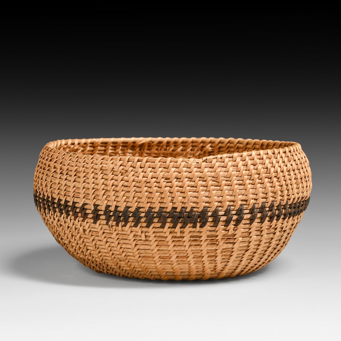Klamath Twined Small Geometric Bowl Basket c1900: Klamath Twined Small Geometric Bowl Basket c1900. Unsigned. Alternating twined construction featuring a continuous horizontal dark brown zig-zag tracking band across the midsection. Perfect condition 
