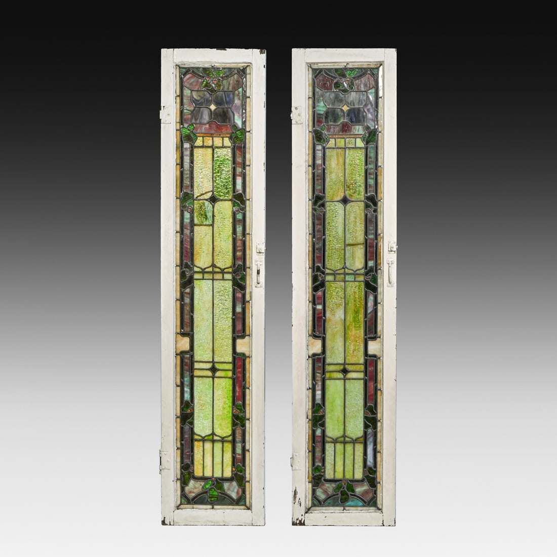 Pair of Antique Berkeley, CA Arts & Crafts Leaded Stained Glass Windows c1905-1910: Pair of Antique Berkeley, CA Arts & Crafts Leaded Stained Glass Windows c1905-1910. Sourced from a historic Berkeley estate. Stable within original sashes. Age-consistent wear includes a stable star f