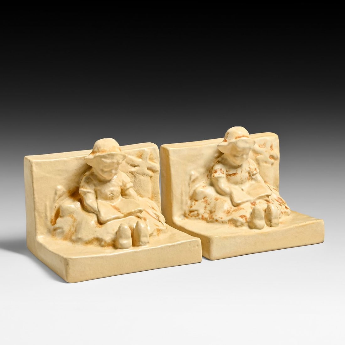 Teco Pottery Pair Children Reading Figural Bookends c1910: Teco Pottery Pair Children Reading Figural Bookends c1910. Signed. Invisible professional restoration to corner chips, otherwise perfect condition. 5"h x 5.75"w x 4.75"d FREE NATIONWIDE SHIPPING Free