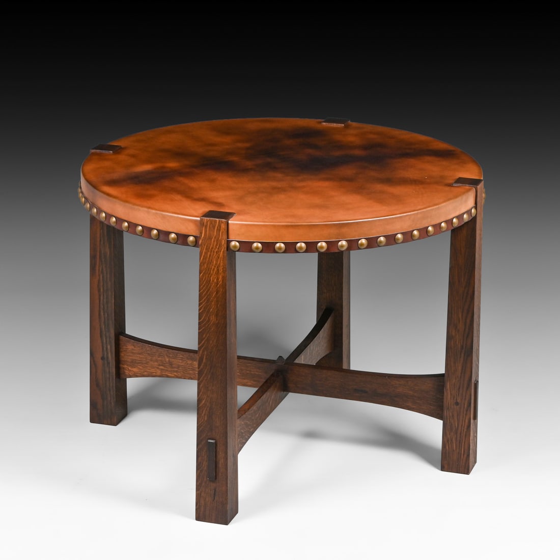 Contemporary Gustav Stickley Reverse-Tapered Leather-Top Table c2000: Contemporary Gustav Stickley Reverse-Tapered Leather-Top Table c2000. Unsigned. Discoloration to leather, otherwise excellent condition. 41"d x 30.5"h FREE NATIONWIDE SHIPPING Free Nationwide Shipping
